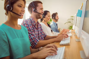 Business team at call center with headsets