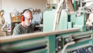 male-employee-working-in-an-industrial-factory