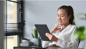 pleasant-asian-female-office-worker-reading-inform