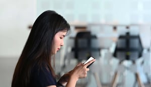 side-view-of-asian-office-employee-woman-sitting
