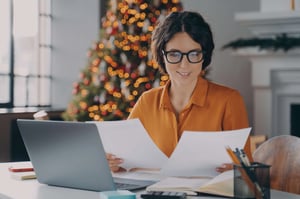 Woman working with Holiday decorations in back